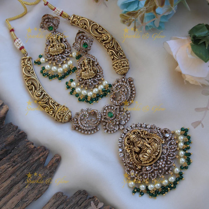 Gorgeous Lakshmi peacock floral design dual tone victorian AD short necklace with pearls and green beads - Sparkle and Glow