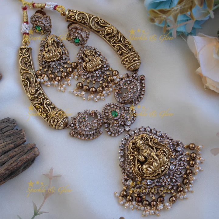 Gorgeous Lakshmi peacock floral design dual tone victorian AD short necklace with pearls and green beads - Sparkle and Glow