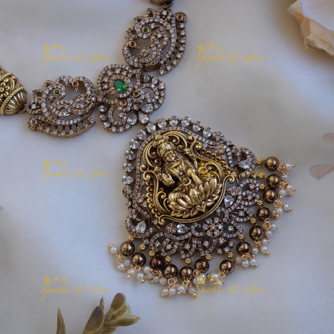 Gorgeous Lakshmi peacock floral design dual tone victorian AD short necklace with pearls and green beads - Sparkle and Glow