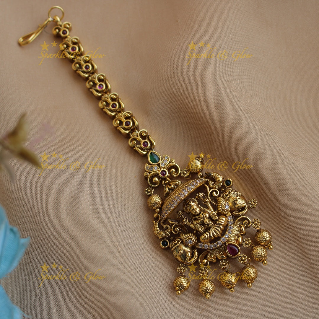 Elegant gold alike lakshmi maang tikka with gold beads