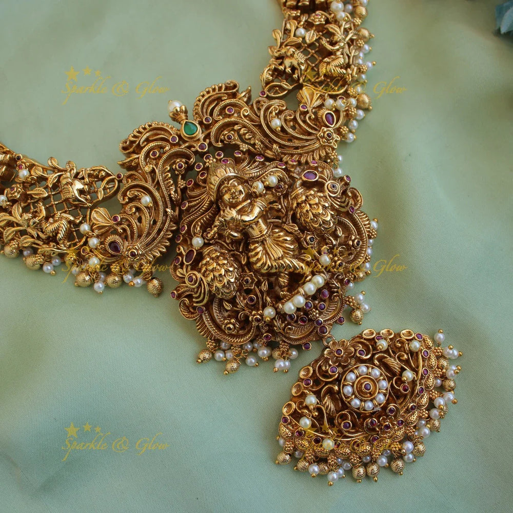 Grand intricate Krishna playing flute and peacock carved short necklace with pearls and gold beads - Sparkle and Glow