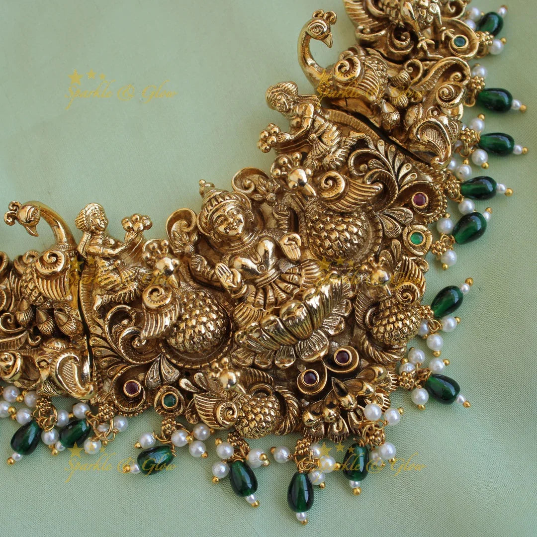 Exquisite gold alike Lakshmi peacock carved short necklace with pearls and green beads - Sparkle and Glow