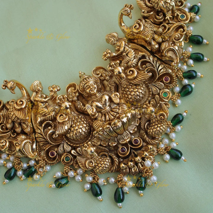 Exquisite gold alike Lakshmi peacock carved short necklace with pearls and green beads - Sparkle and Glow