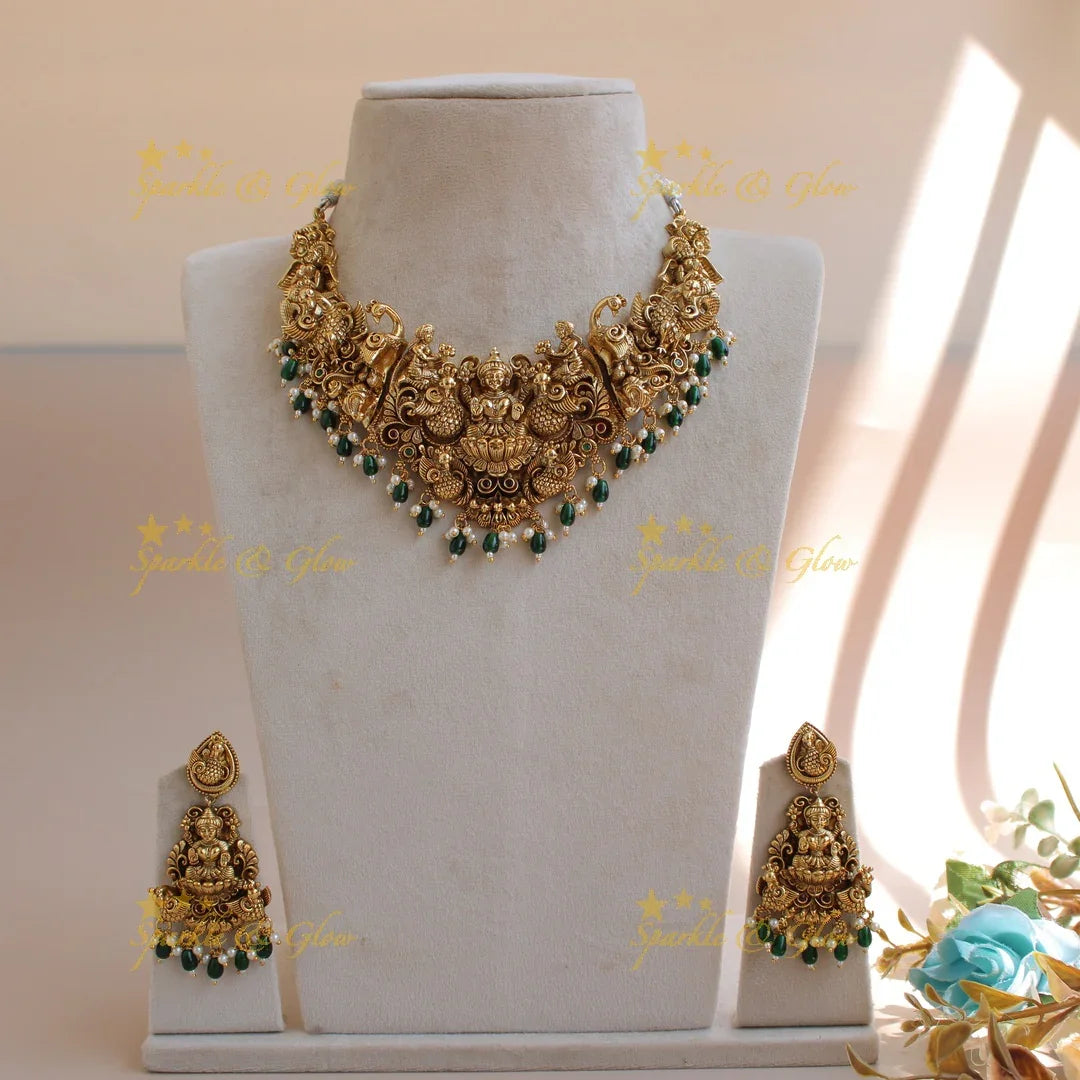 Exquisite gold alike Lakshmi peacock carved short necklace with pearls and green beads - Sparkle and Glow