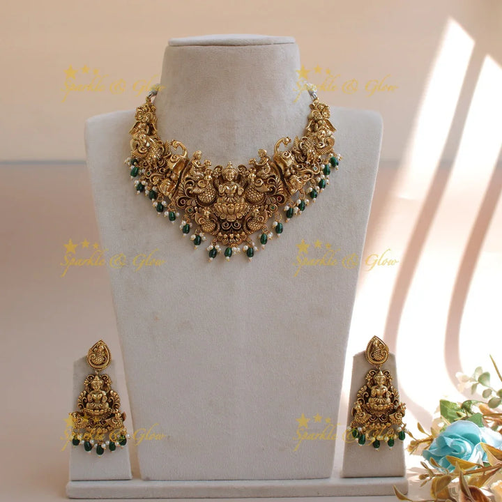 Exquisite gold alike Lakshmi peacock carved short necklace with pearls and green beads - Sparkle and Glow