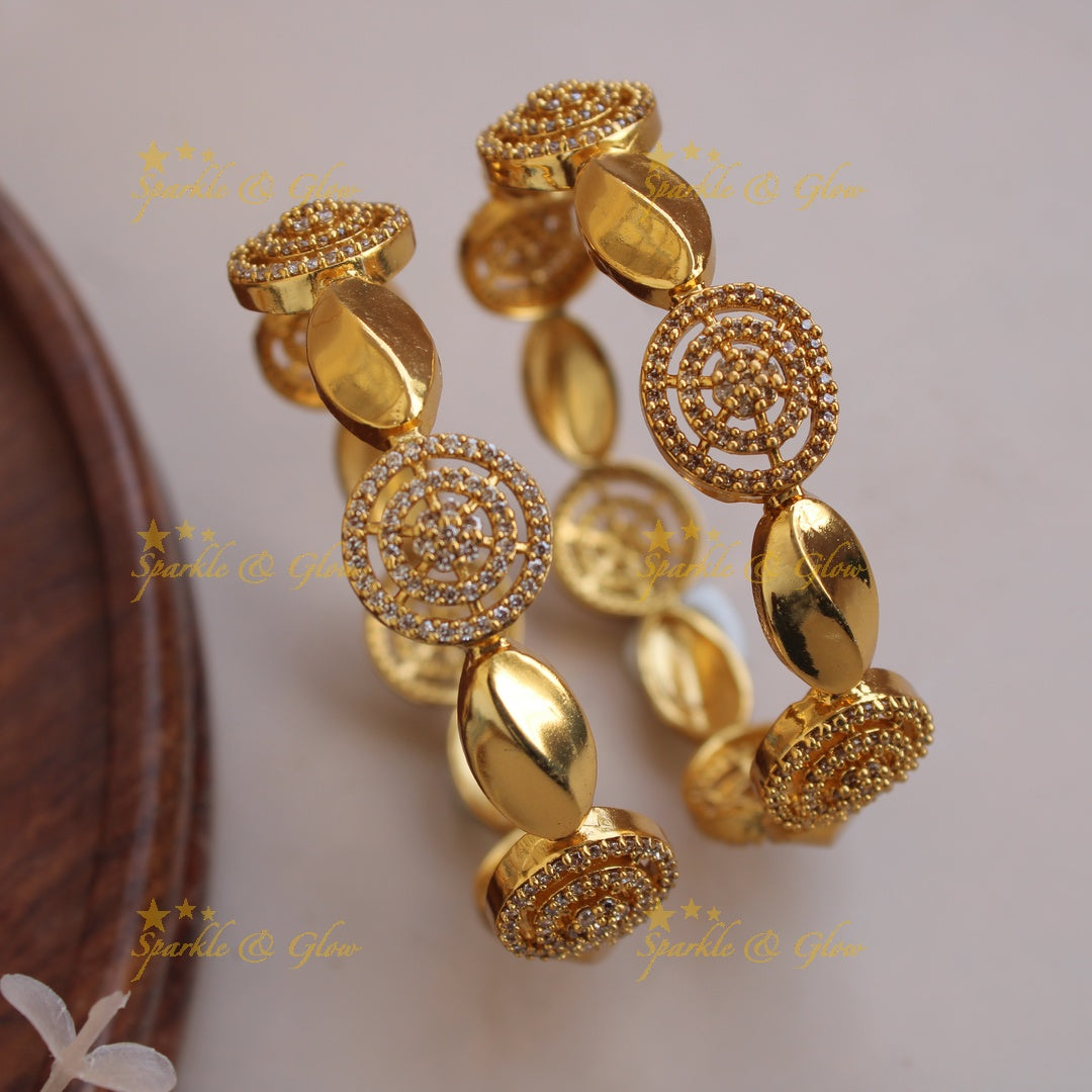 Stunning Oval and spiral design bangles with white stones a pair,