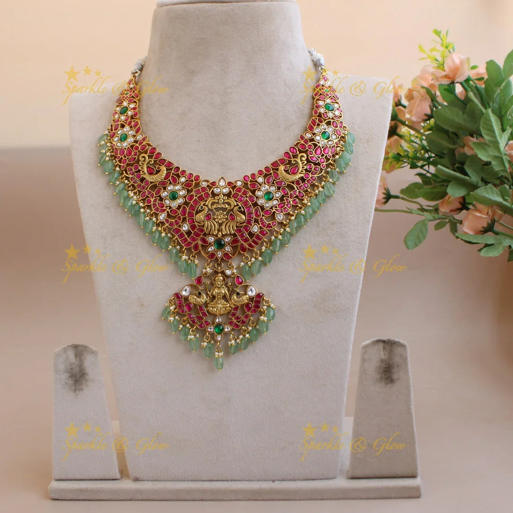 Grand intricate Lakshmi peacock carved floral jadau short necklace with pearls and mint green beads - Sparkle and Glow