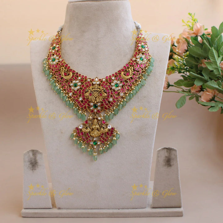 Grand intricate Lakshmi peacock carved floral jadau short necklace with pearls and mint green beads - Sparkle and Glow
