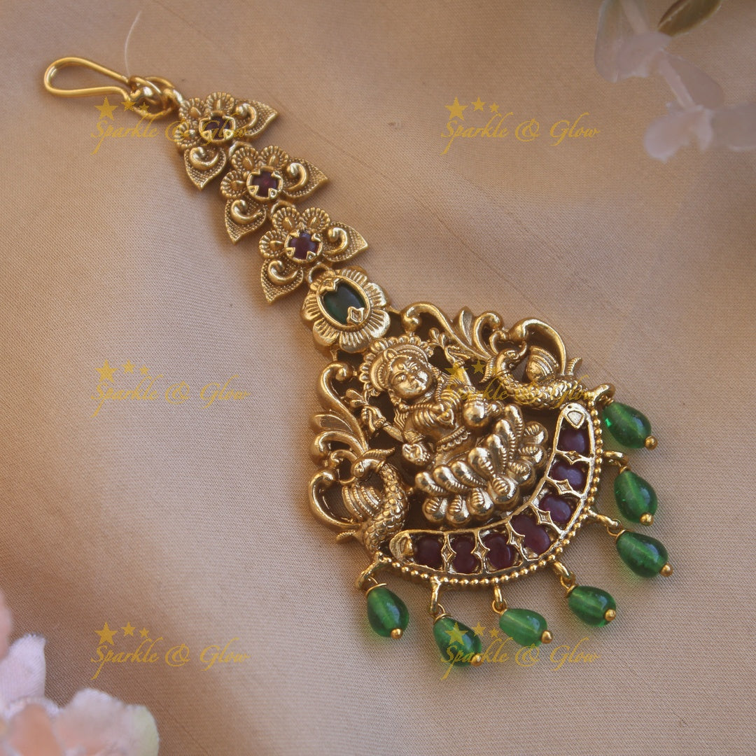 Elegant gold alike curved lakshmi with green beads maang tikka