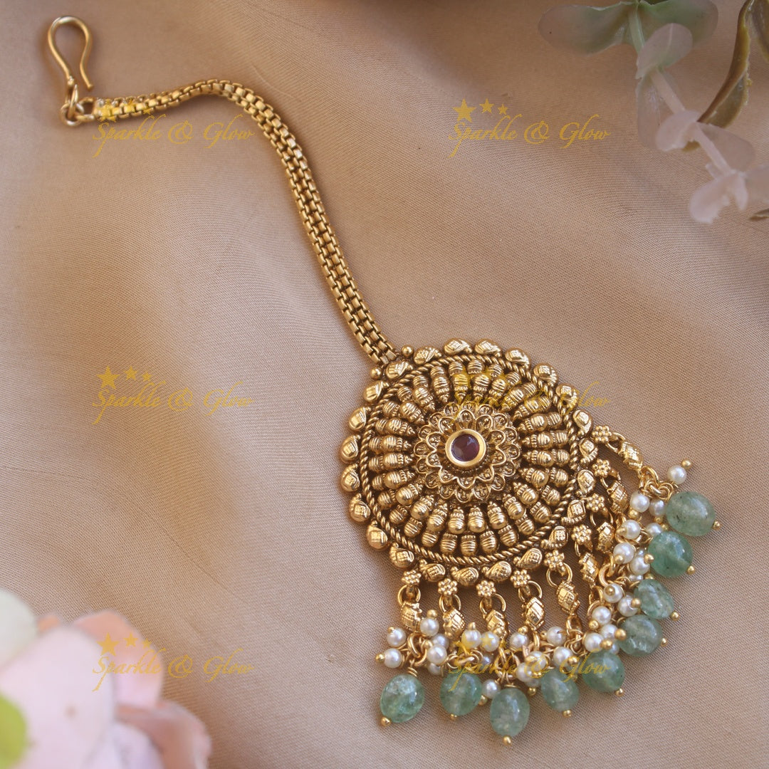 Simple gold alike round shaped floral design with mint green beads maang tikka