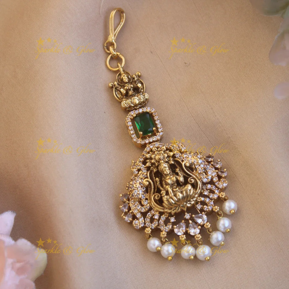 Beautiful Lakshmi flower carved maang tikka with ruby CZ stones and pearl drops - Sparkle and Glow