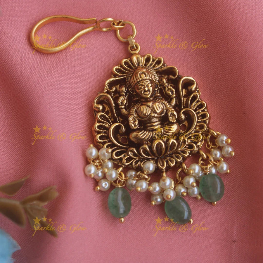Gold alike Lakshmi carved maang tikka with pearls and mint green beads - Sparkle and Glow