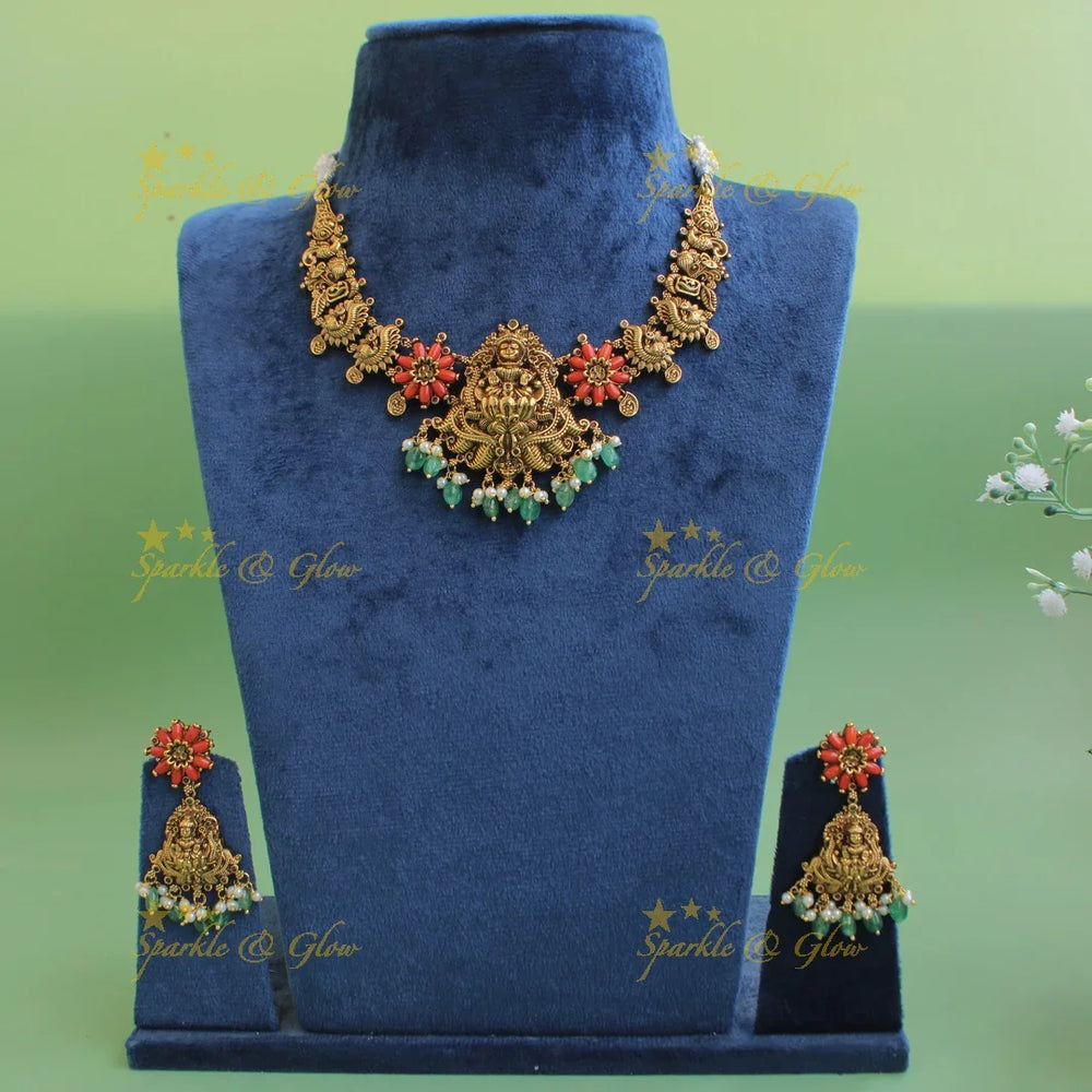 Statement Lakshmi peacock carved short necklace with coral and mint green beads - Sparkle and Glow