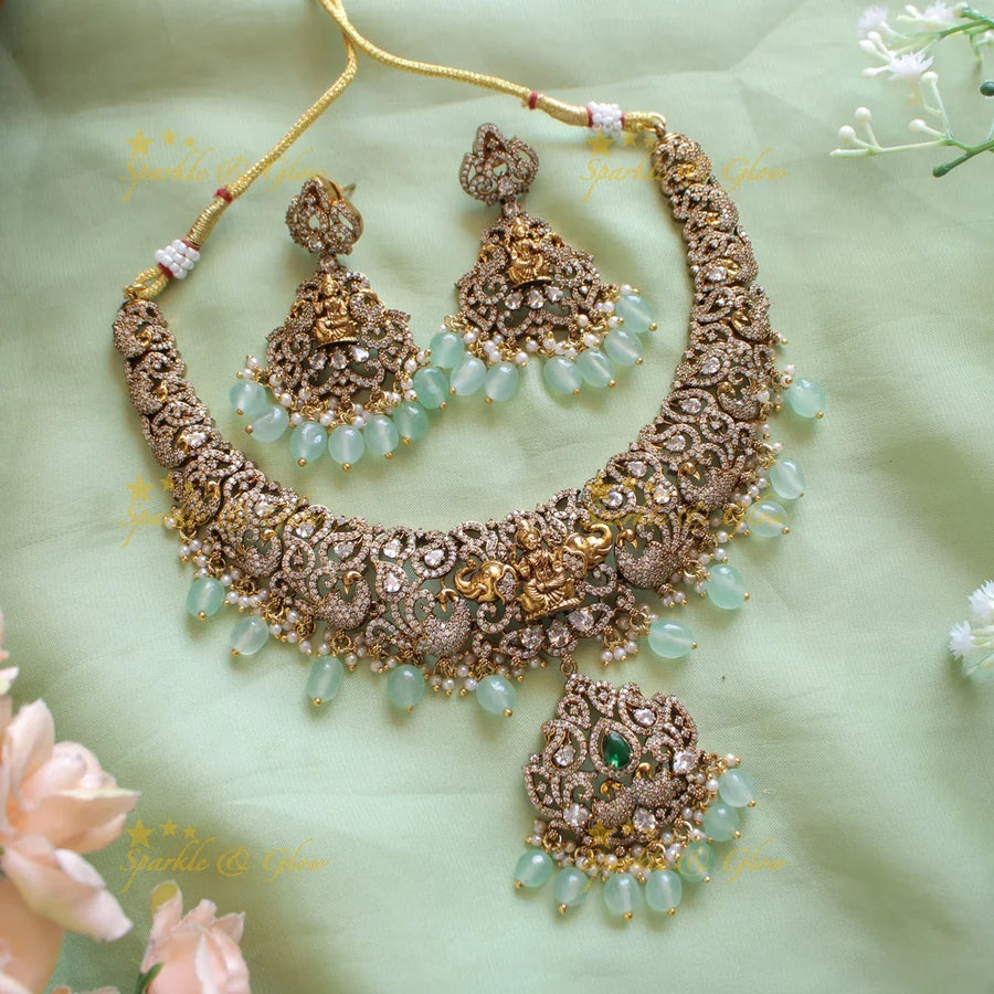 Elegant Lakshmi elephant peacock design dual tone victorian AD short necklace withmint green beads - Sparkle and Glow
