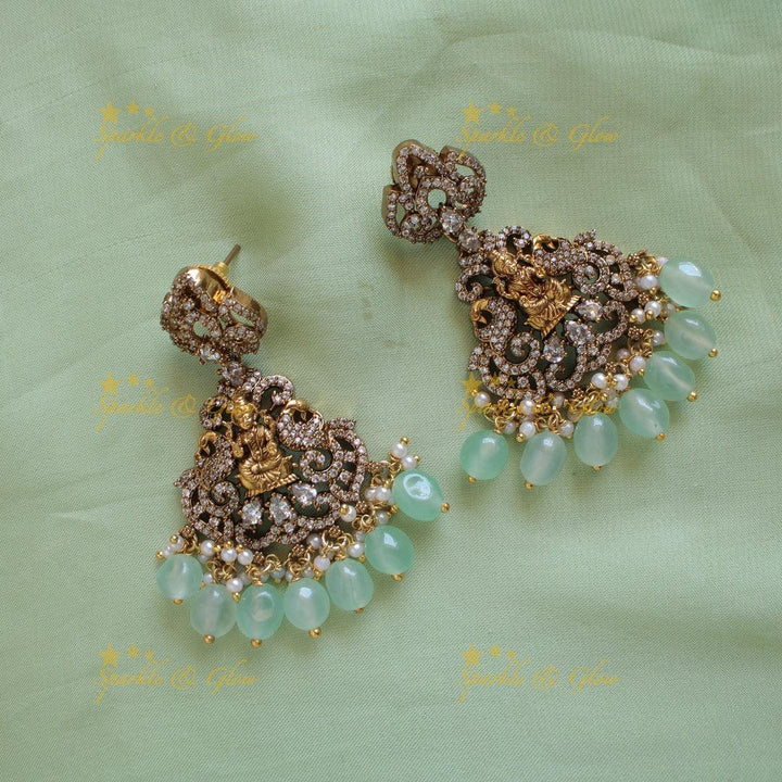 Elegant Lakshmi elephant peacock design dual tone victorian AD short necklace withmint green beads - Sparkle and Glow