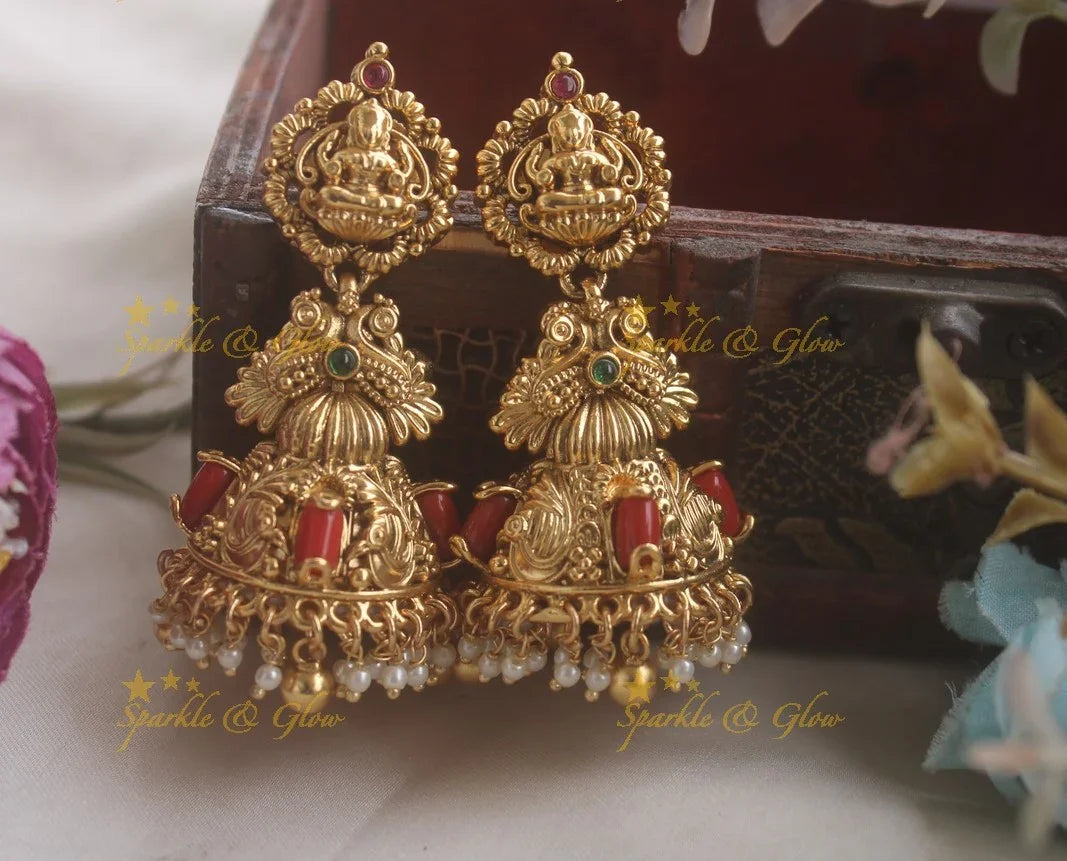 Idol Lakshmi Peacock Carved Jhumukas with Coral Beads - Sparkle and Glow