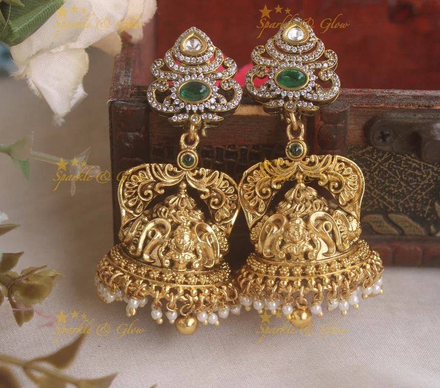Beautiful Idol Lakshmi Crown design Jhumukas with emerald stone - Sparkle and Glow