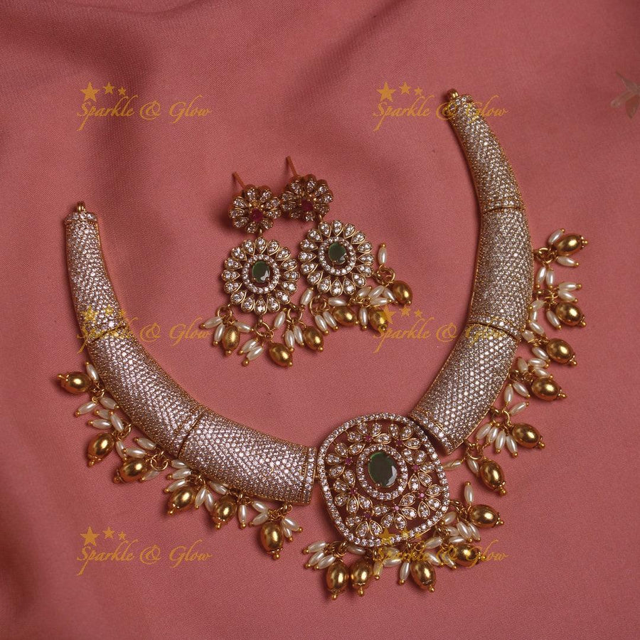 Gorgeous Tribal and floral design AD short necklace with emeralds rice pearls and gold beads - Sparkle and Glow