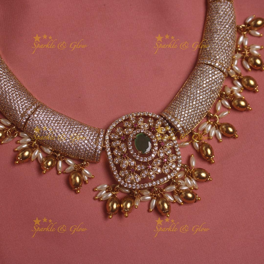 Gorgeous Tribal and floral design AD short necklace with emeralds rice pearls and gold beads - Sparkle and Glow