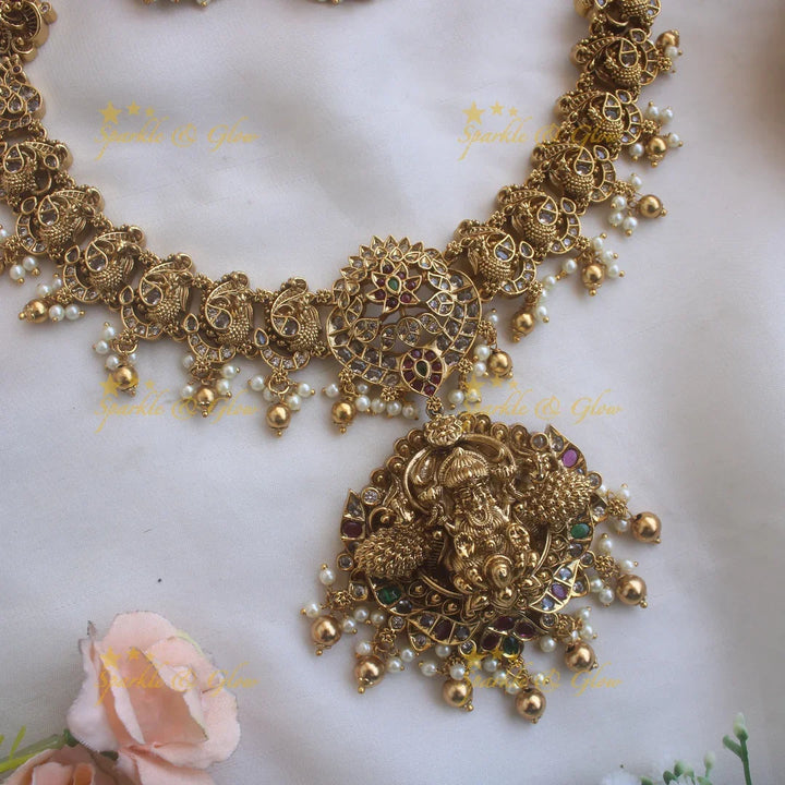 Statement Lakshmi peacock carved long necklace with ruby emerald CZ stones pearls and gold beads - Sparkle and Glow