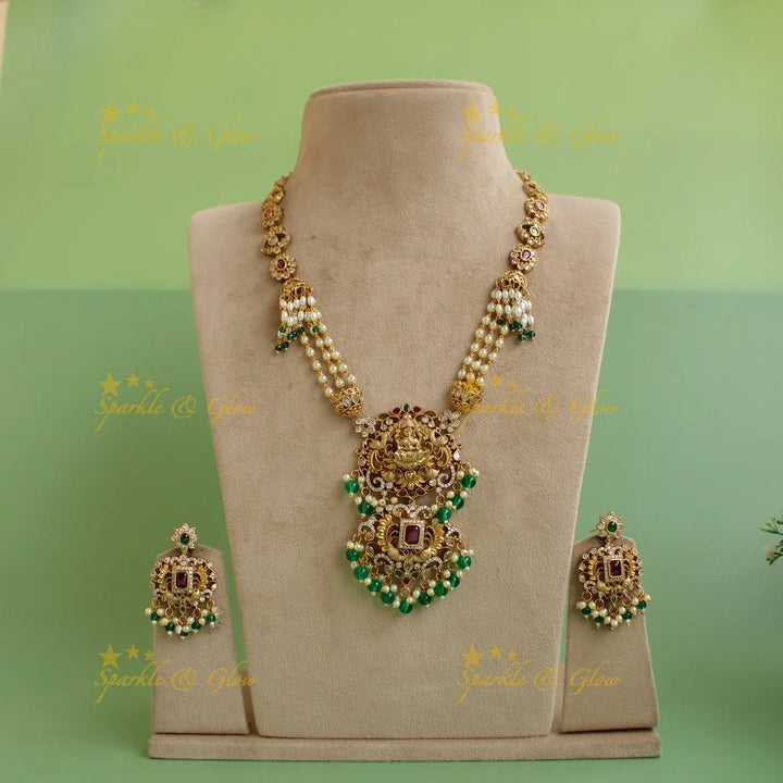 Grand intricate Lakshmi peacock carved long necklace with ruby emerald white stones pearls and green beads - Sparkle and Glow