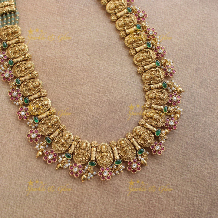 Gorgeous Lakshmi carved floral long necklace with ruby emerald and mint green beads - Sparkle and Glow