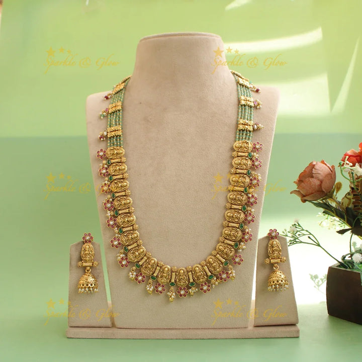 Gorgeous Lakshmi carved floral long necklace with ruby emerald and mint green beads - Sparkle and Glow