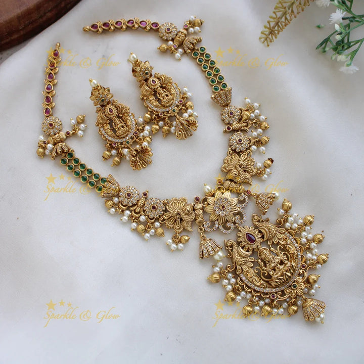 Premium Matt Lakshmi peacock flower carved short necklace with ruby emerald CZ stones pearls and gold beads - Sparkle and Glow