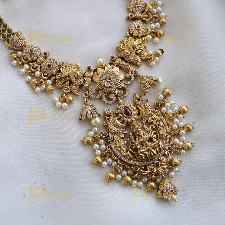 Premium Matt Lakshmi peacock flower carved short necklace with ruby emerald CZ stones pearls and gold beads - Sparkle and Glow