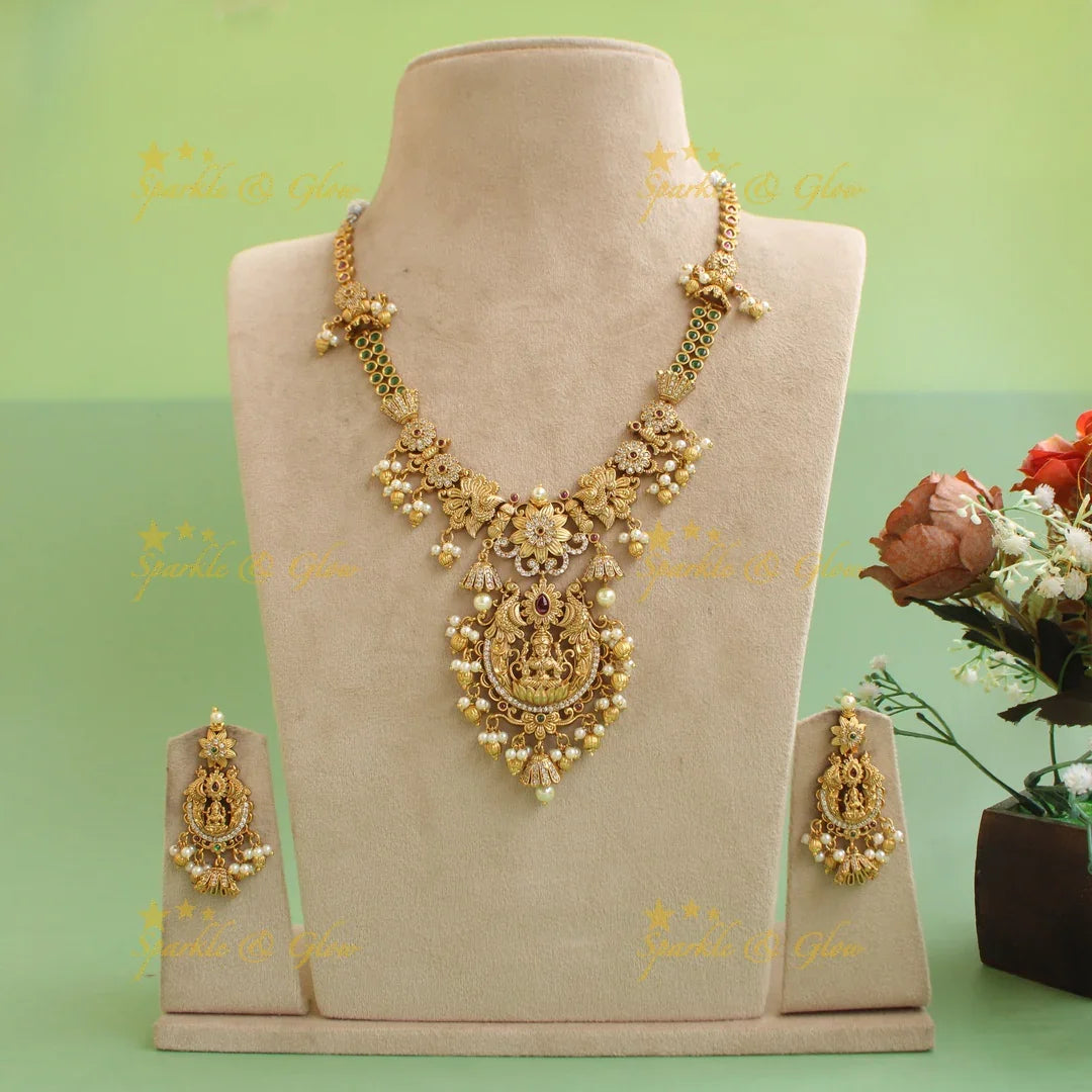 Premium Matt Lakshmi peacock flower carved short necklace with ruby emerald CZ stones pearls and gold beads - Sparkle and Glow