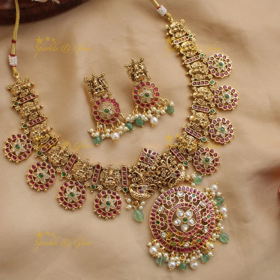 Beautiful Lakshmi peacock carved floral design bottu short necklace with kemp stones and mint green beads - Sparkle and Glow