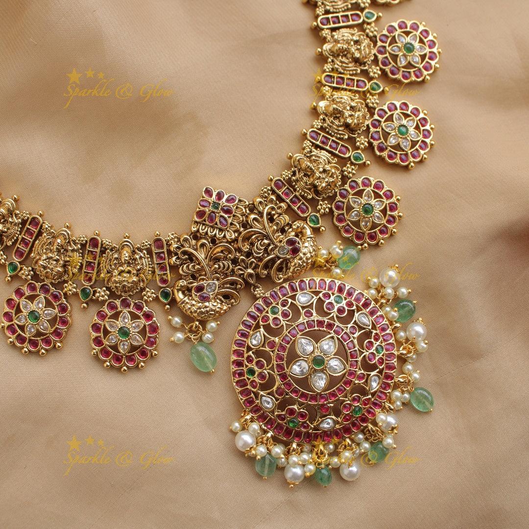 Beautiful Lakshmi peacock carved floral design bottu short necklace with kemp stones and mint green beads - Sparkle and Glow