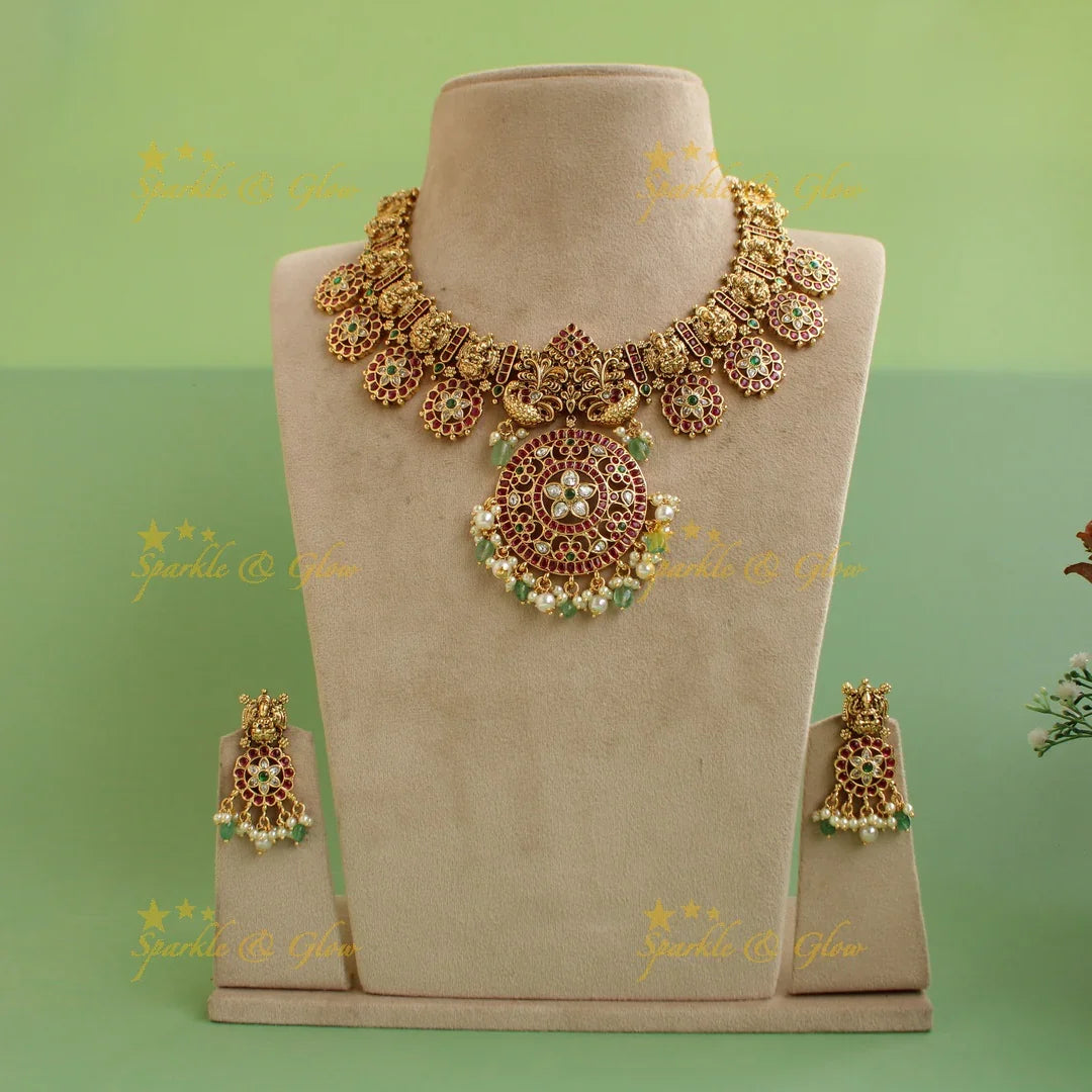 Beautiful Lakshmi peacock carved floral design bottu short necklace with kemp stones and mint green beads - Sparkle and Glow