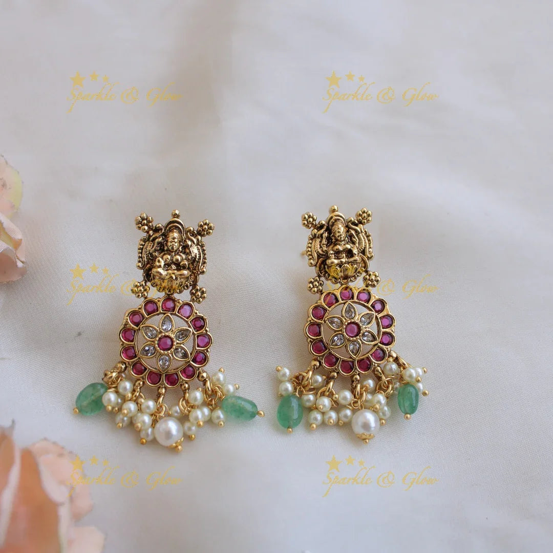 Gorgeous Lakshmi peacock carved floral design bottu long necklace with kemp stones and mint green beads - Sparkle and Glow