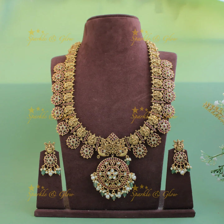 Gorgeous Lakshmi peacock carved floral design bottu long necklace with kemp stones and mint green beads - Sparkle and Glow