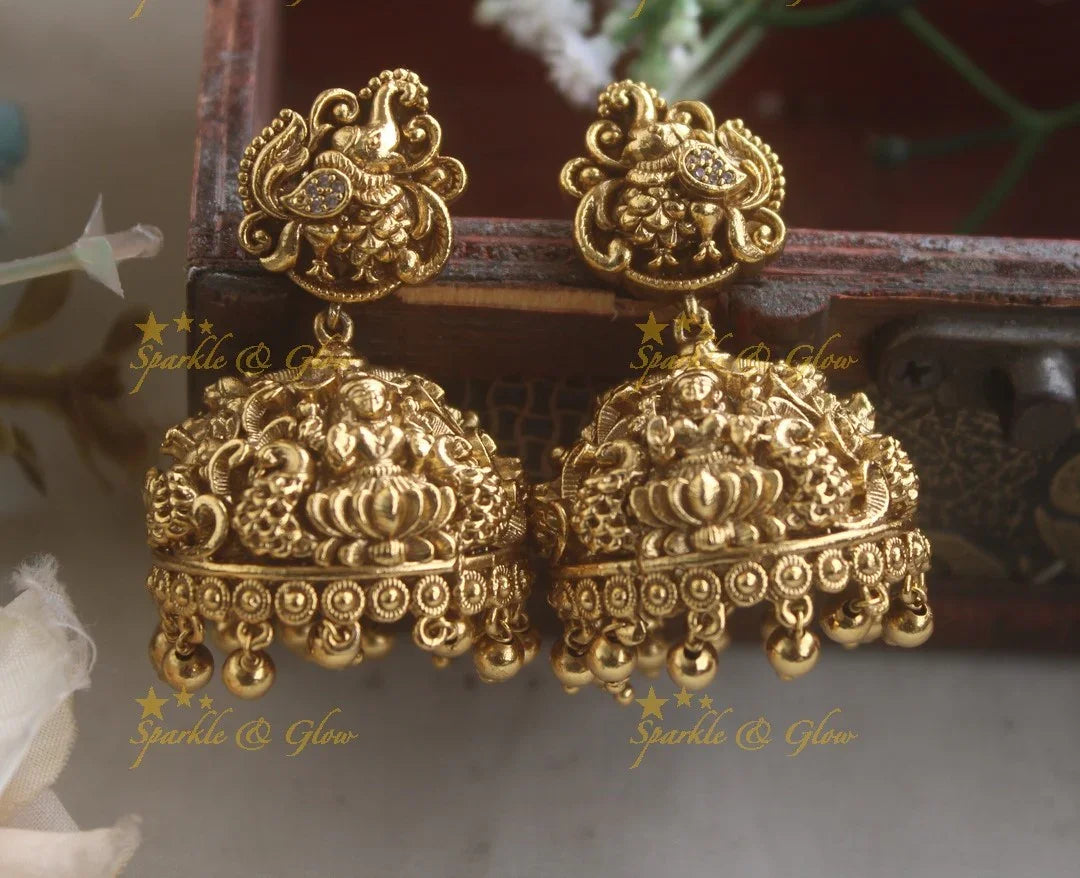 Intricately carved Idol lakshmi Elephant peacock carved earrings - Sparkle and Glow