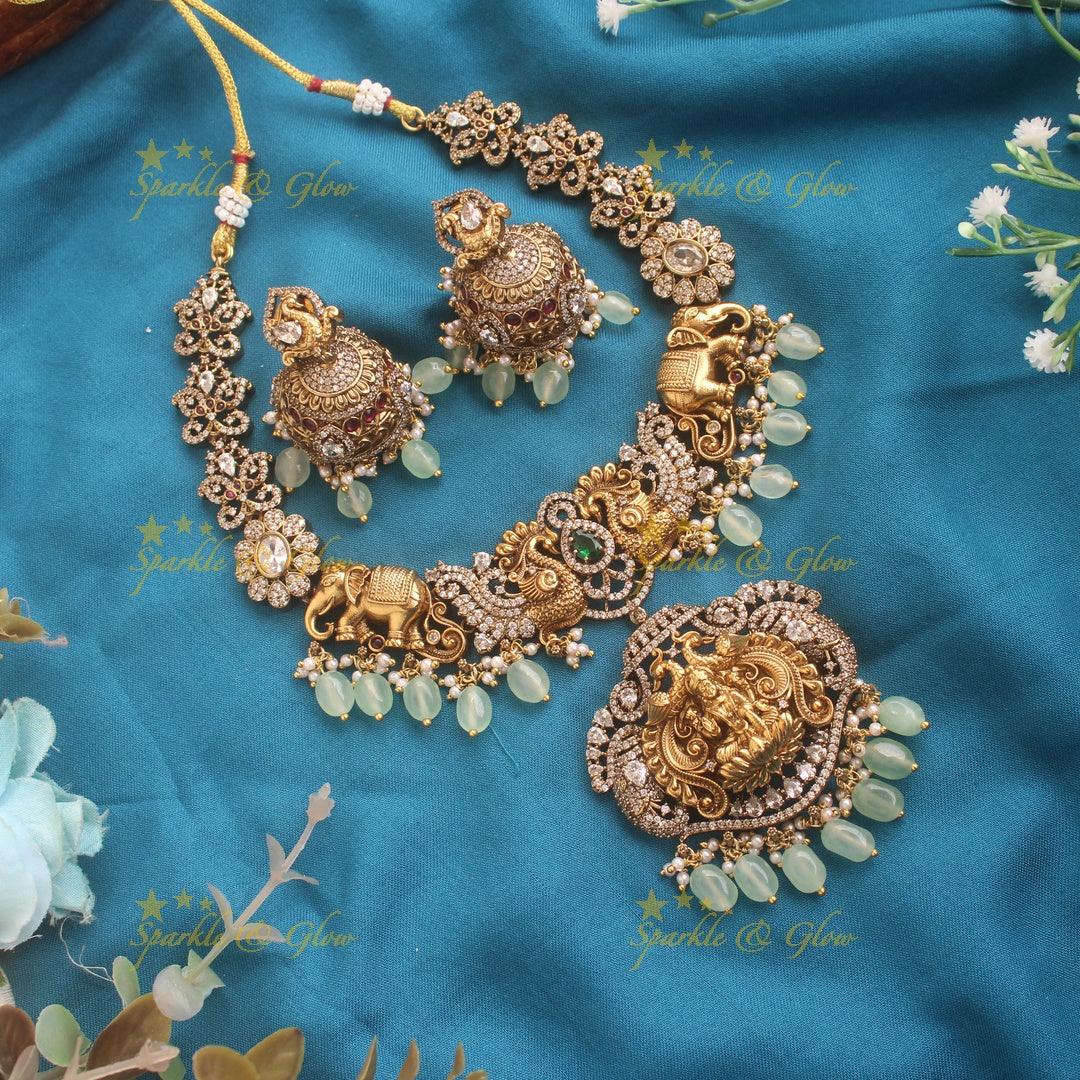 Elegant Lakshmi elephant and peacock carved dual tone Victorian AD short necklace with mint green beads - Sparkle and Glow
