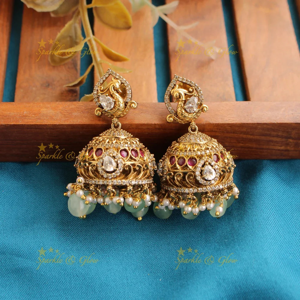 Elegant Lakshmi elephant and peacock carved dual tone Victorian AD short necklace with mint green beads - Sparkle and Glow