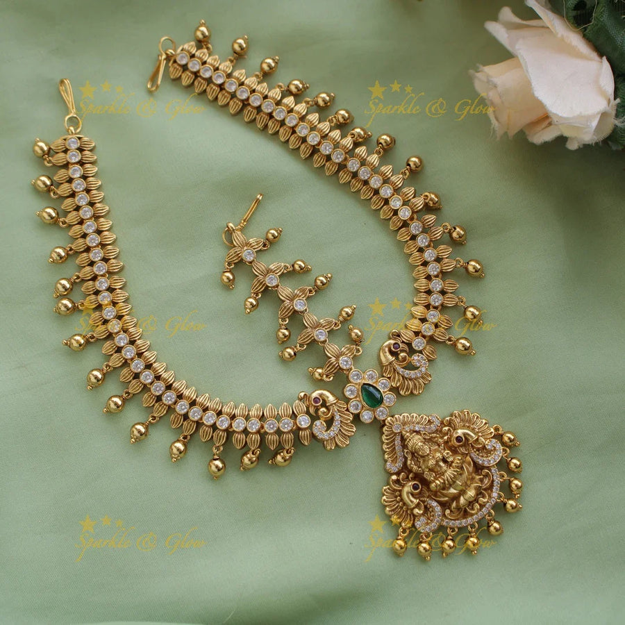 Idol Lakshmi Peacock Floral Bridal Tikka with Gold beads - Sparkle and Glow