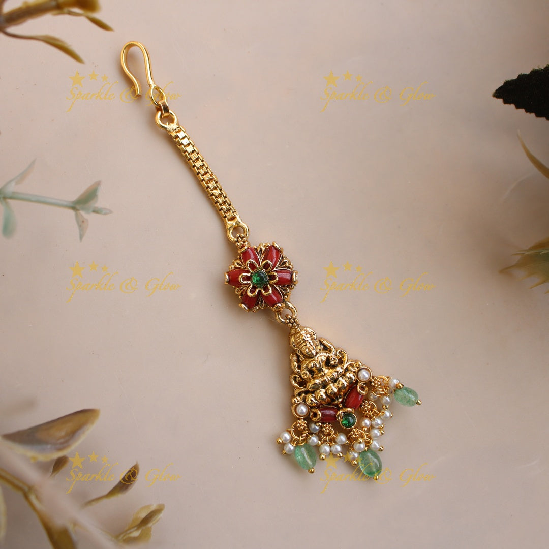 Beautiful Lakshmi carved maang tikka with coral and mint green beads