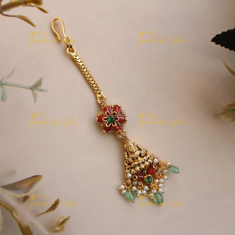 Beautiful Lakshmi carved maang tikka with coral and mint green beads - Sparkle and Glow