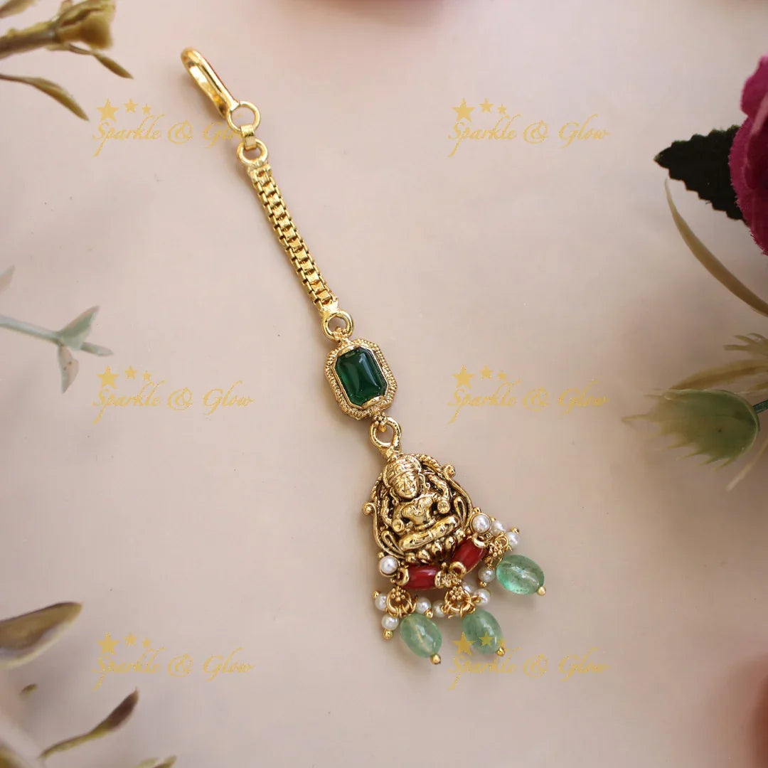 Elegant Lakshmi carved maang tikka with coral emerald and mint green beads - Sparkle and Glow