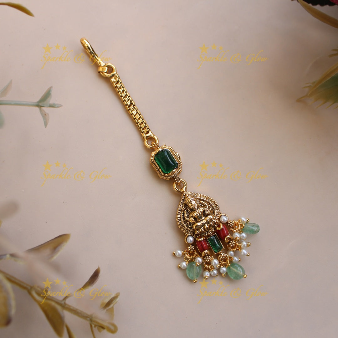 Elegant Lakshmi maang tikka with coral emerald and mint green beads