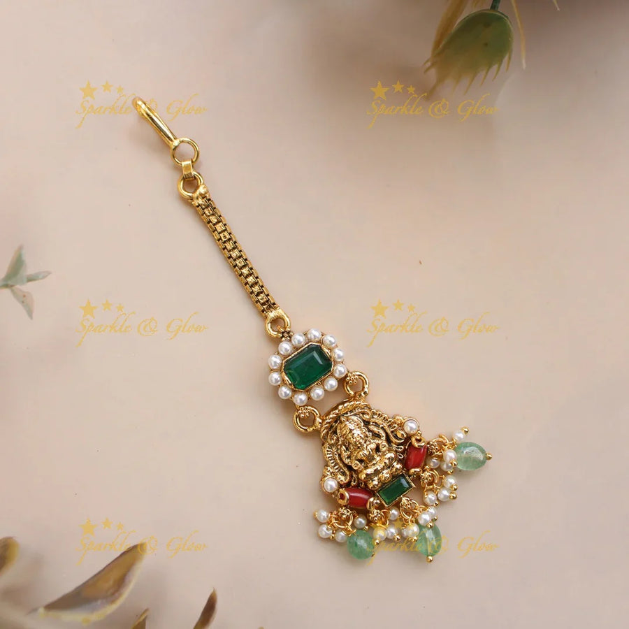 Beautiful Lakshmi maang tikka with coral pearls emerald and mint green beads - Sparkle and Glow