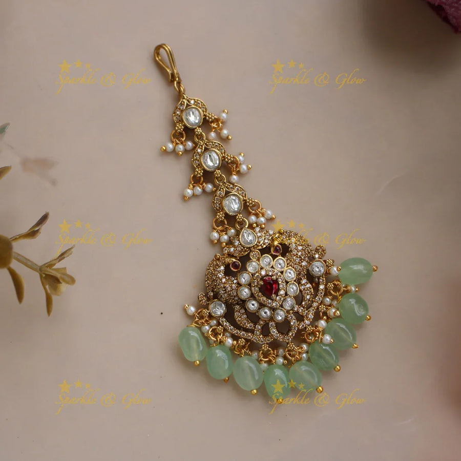 Stunning Peacock Victorian AD maang tikka with ruby and mint green beads - Sparkle and Glow