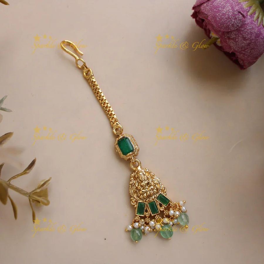 Elegant Lakshmi carved maang tikka with emerald and mint green beads - Sparkle and Glow