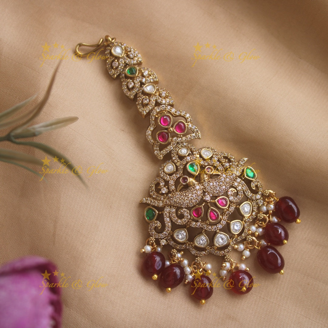 Beautiful Peacock design Victorian AD maang tikka with stones and maroon beads