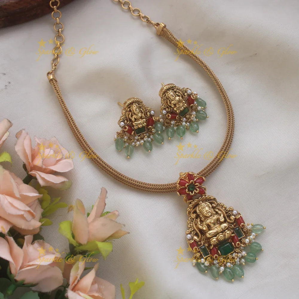 Elegant Lakshmi floral design pendant Chain with coral emerald and mint green beads - Sparkle and Glow