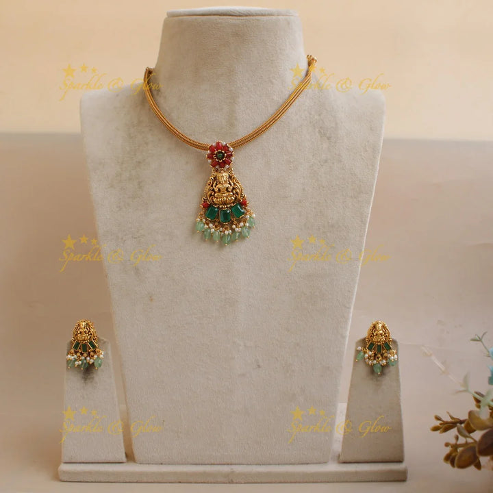 Stunning Lakshmi floral design pendant Chain with coral emerald and mint green beads - Sparkle and Glow