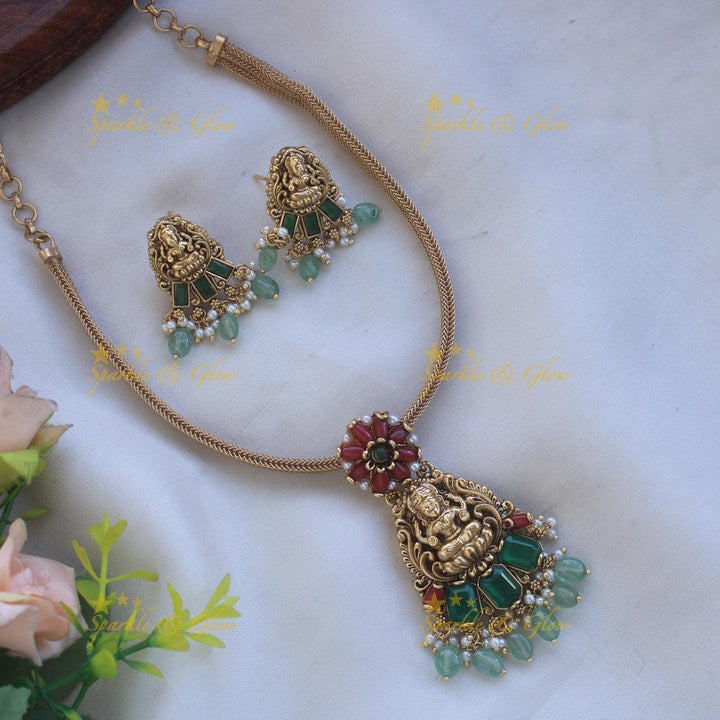 Stunning Lakshmi floral design pendant Chain with coral emerald and mint green beads - Sparkle and Glow